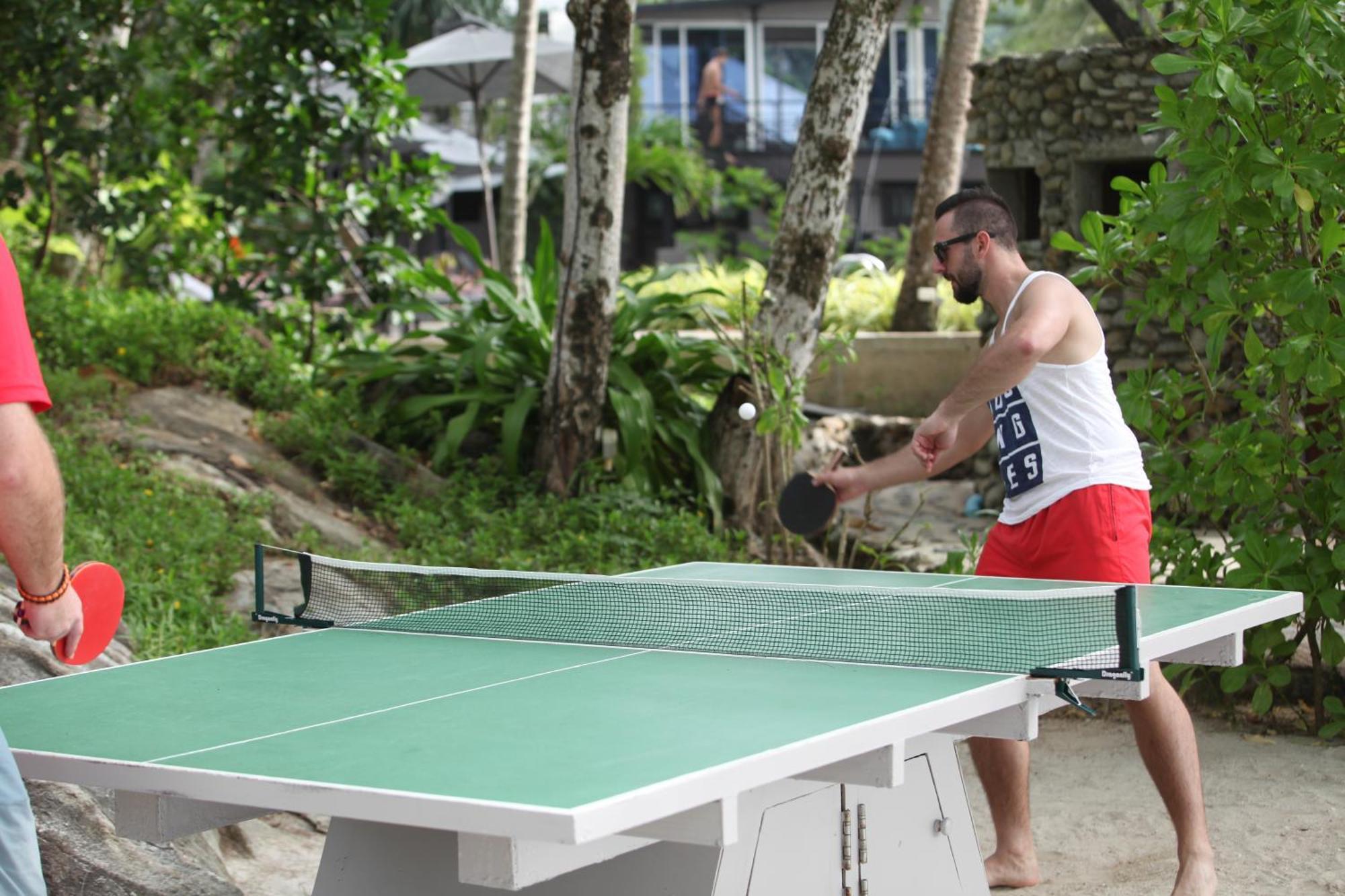 Moracea By Khao Lak Resort Exterior foto A table tennis player